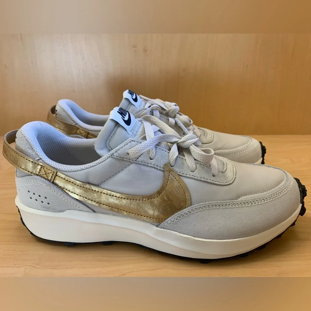 Nike Women's Light Gray Sneakers with Mustard Swoosh